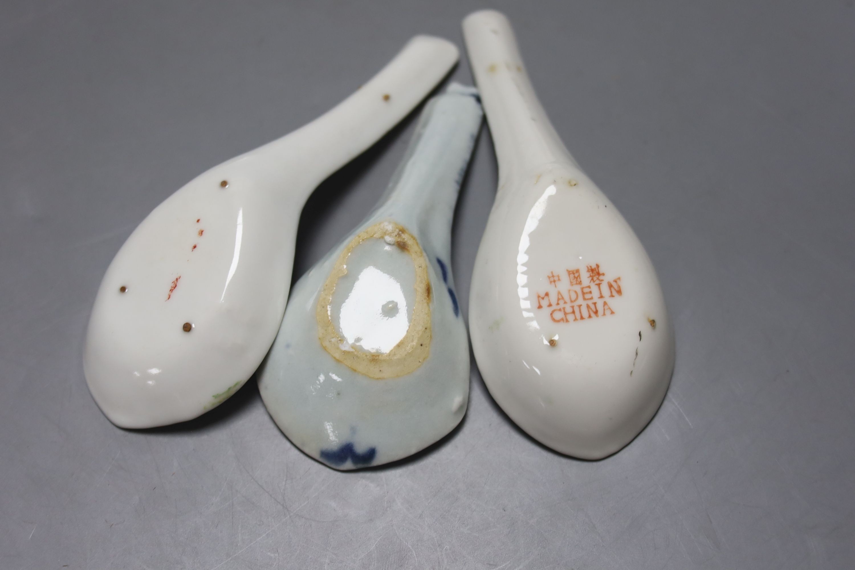 Eleven Chinese porcelain rice spoons, largest 15 cms long.